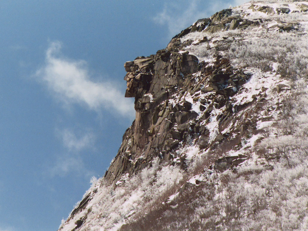 Photograph of the Old Man of the Mountain atop Cannon Mountain in the winter time