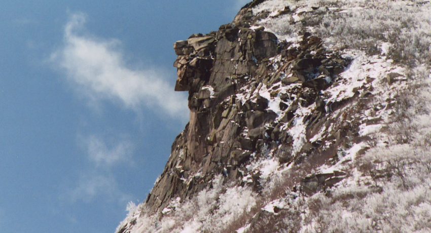 Photograph of the Old Man of the Mountain atop Cannon Mountain in the winter time